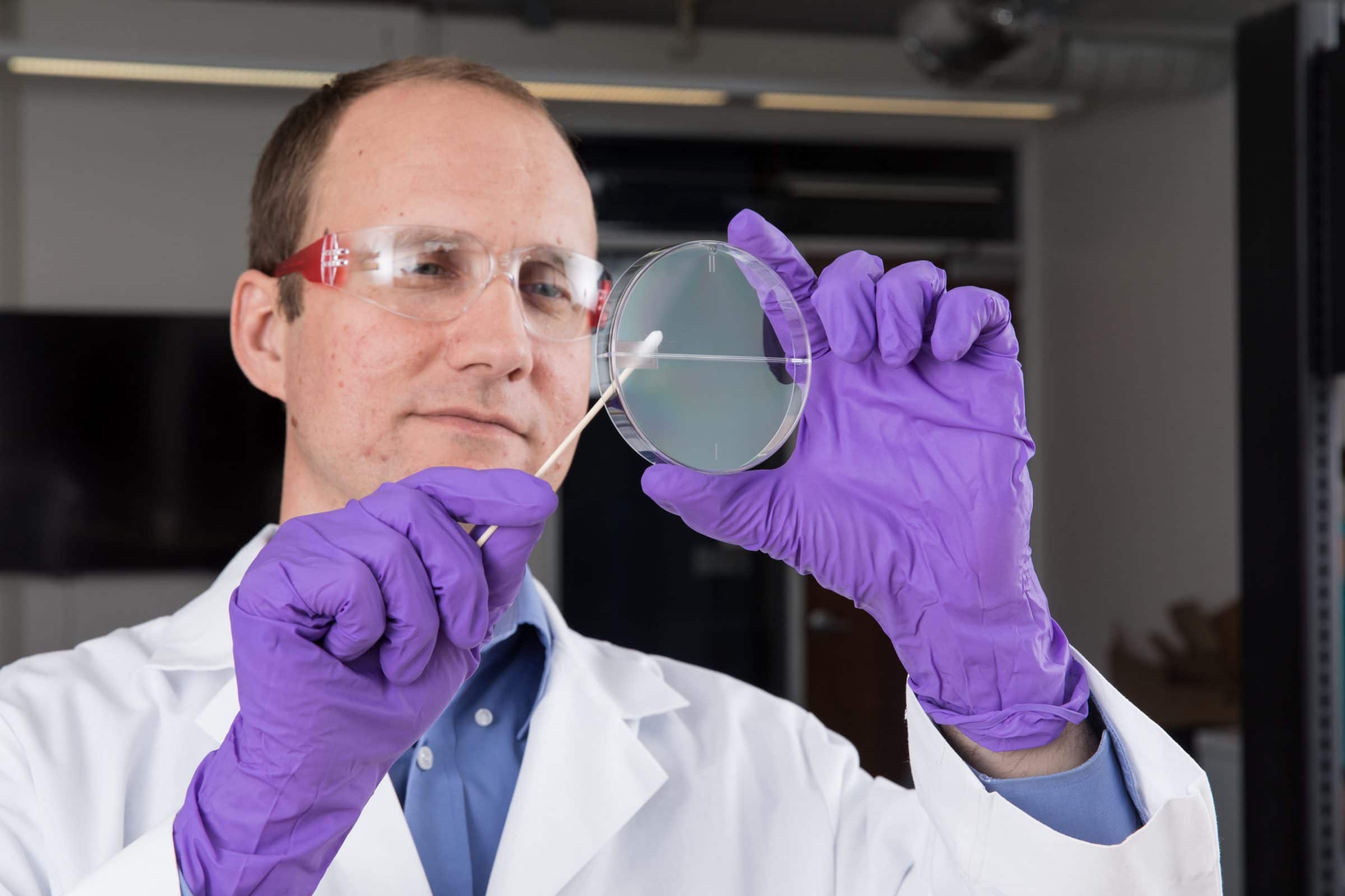 Viacheslav “Slava” Fofanov holding petri dish.