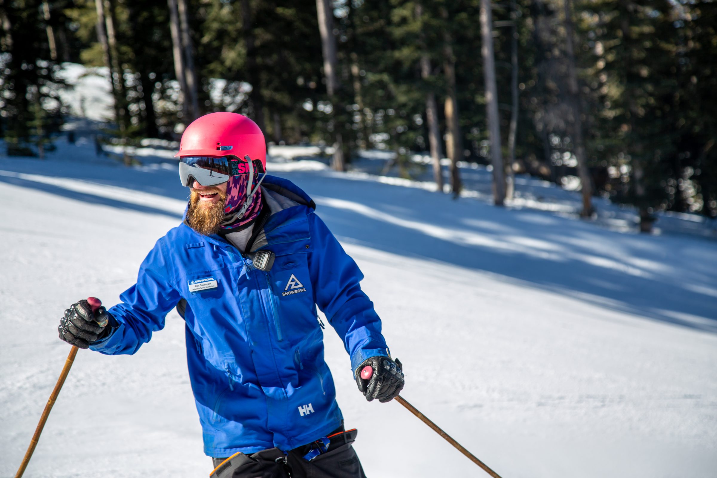 A skier going down a mountain.
