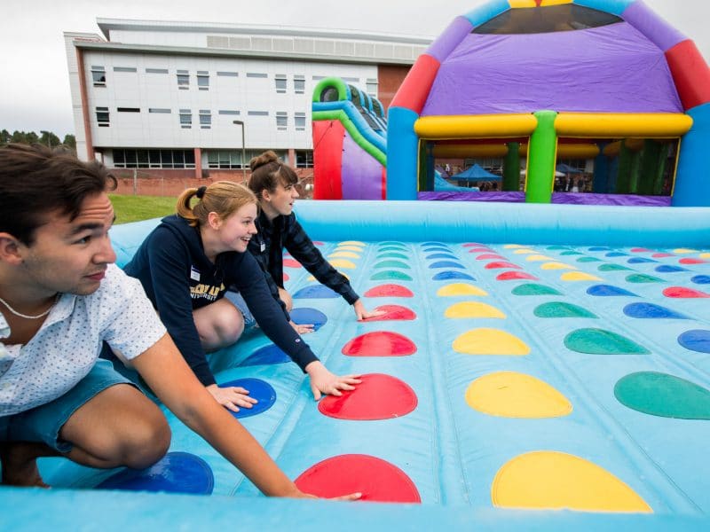 Students play the Twister game.