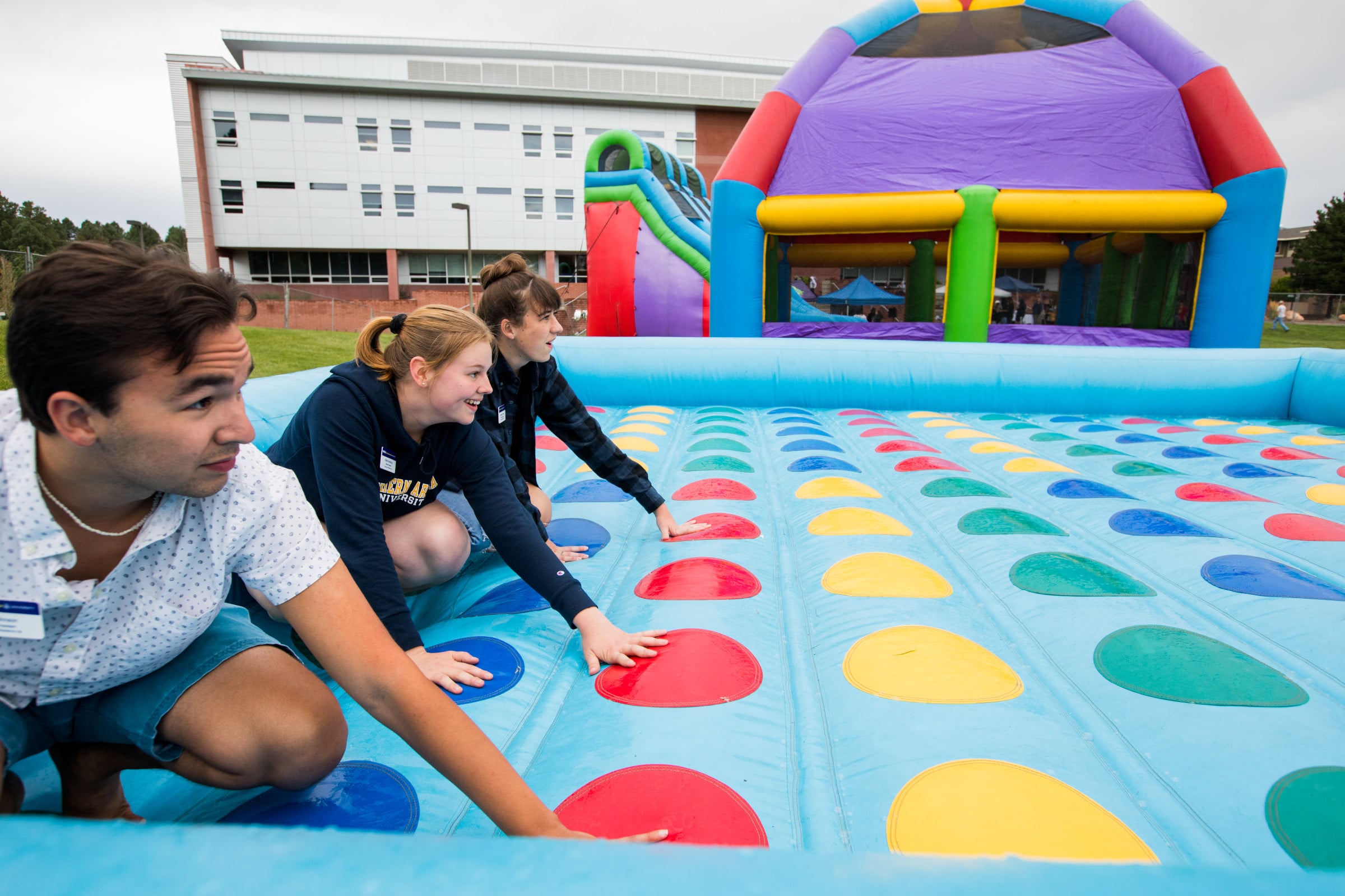 Students play the Twister game.