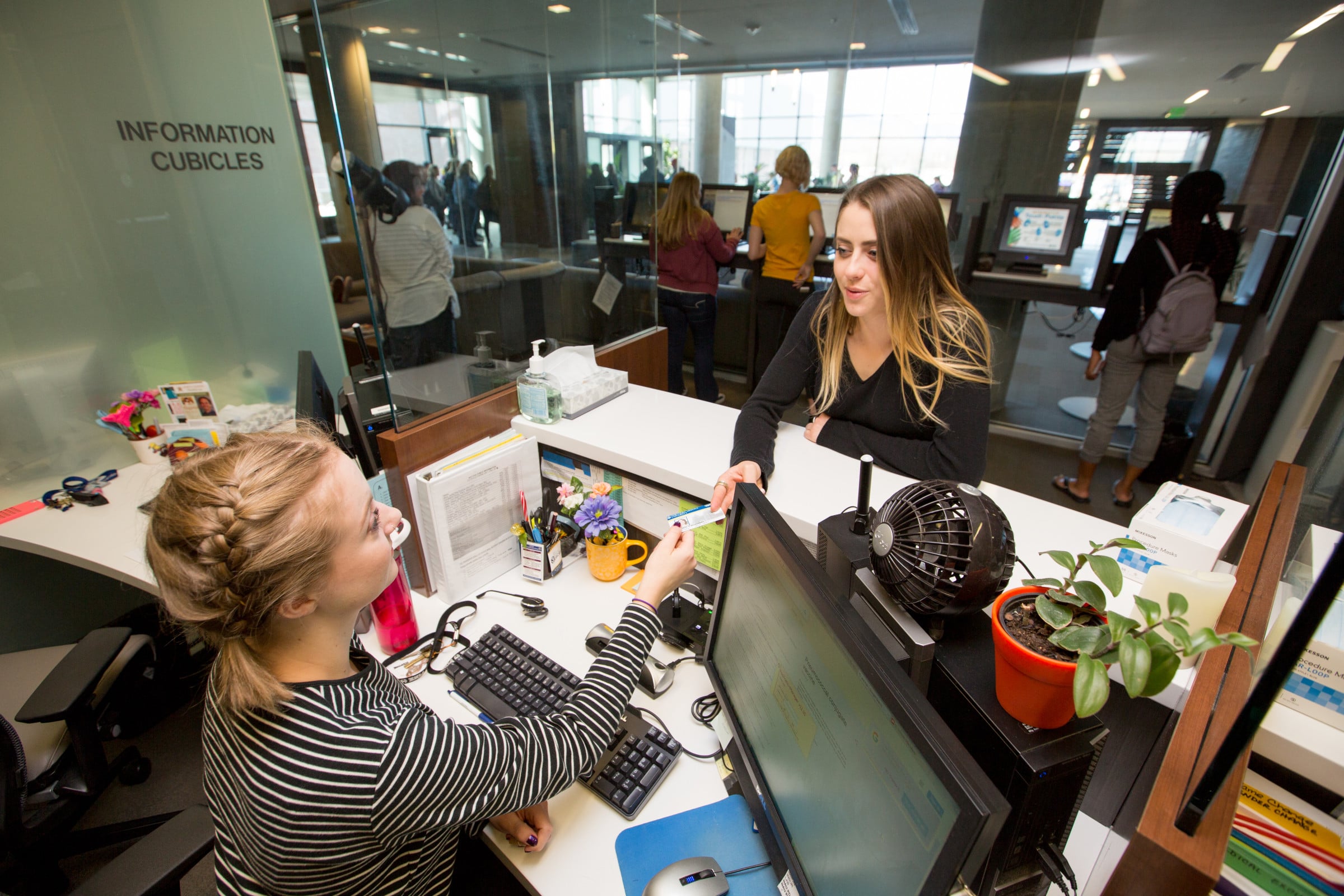 Student gets checked into to campus doctor's office.
