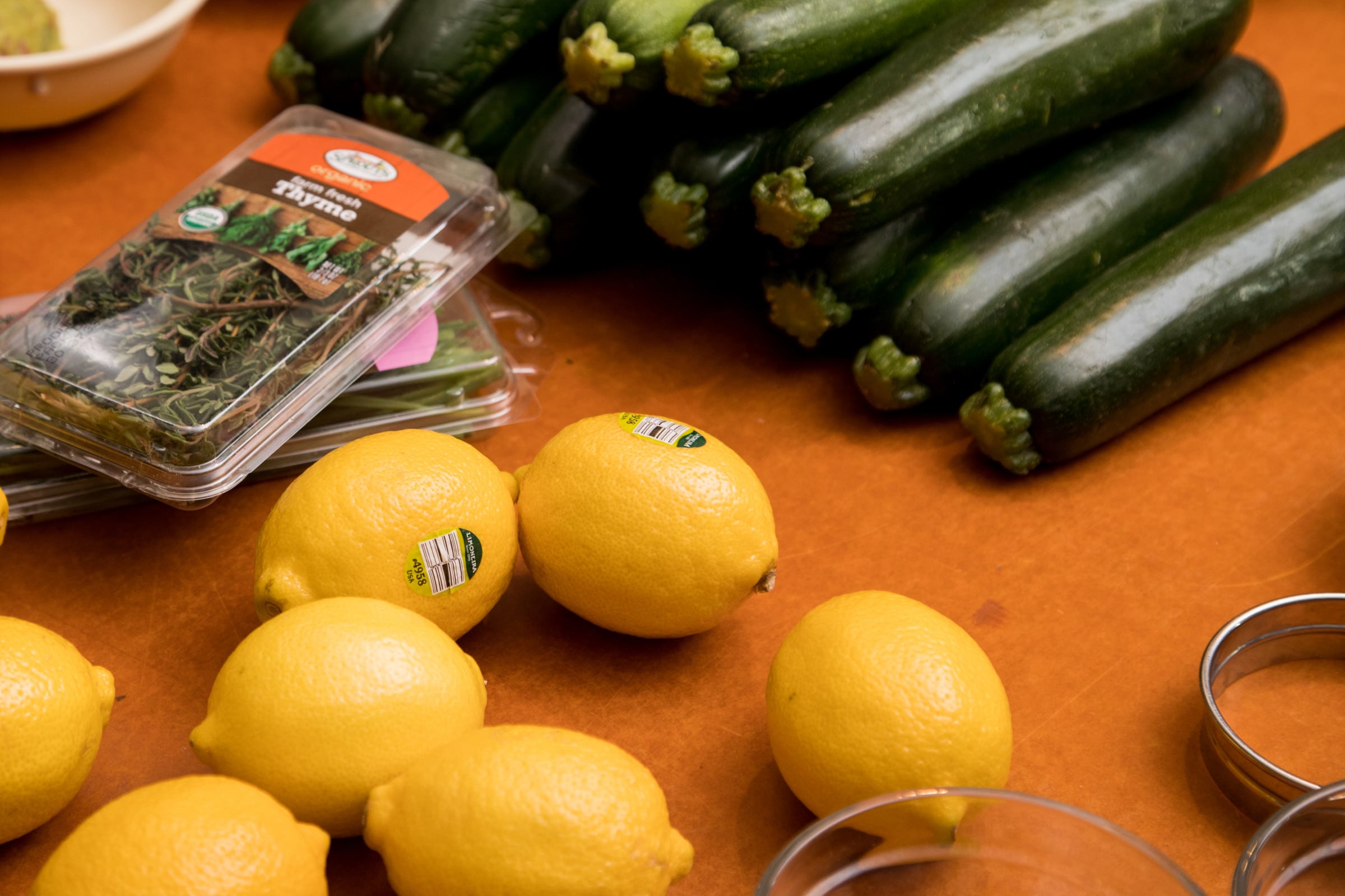 Fresh lemons, basil and zucchini.