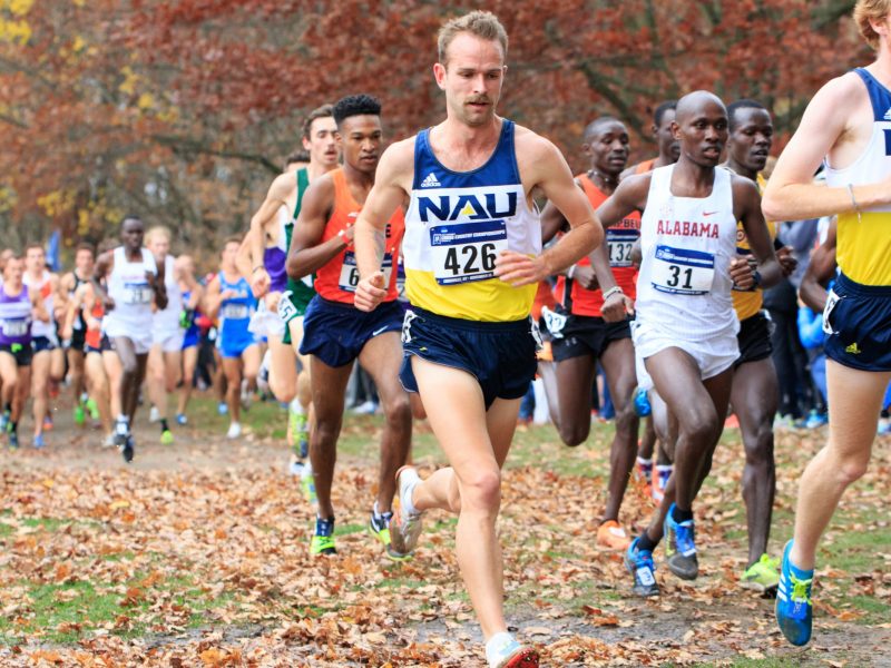 NAU cross country team runner running in a race.