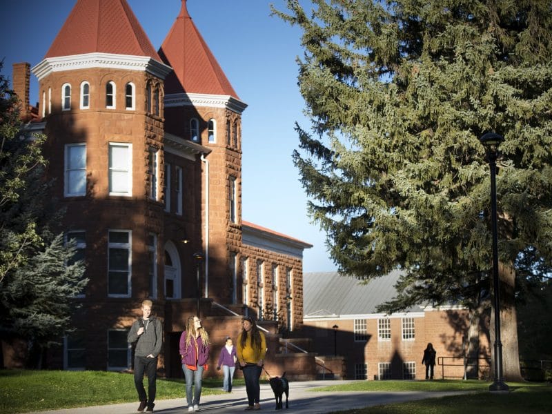 Students walking outside old main