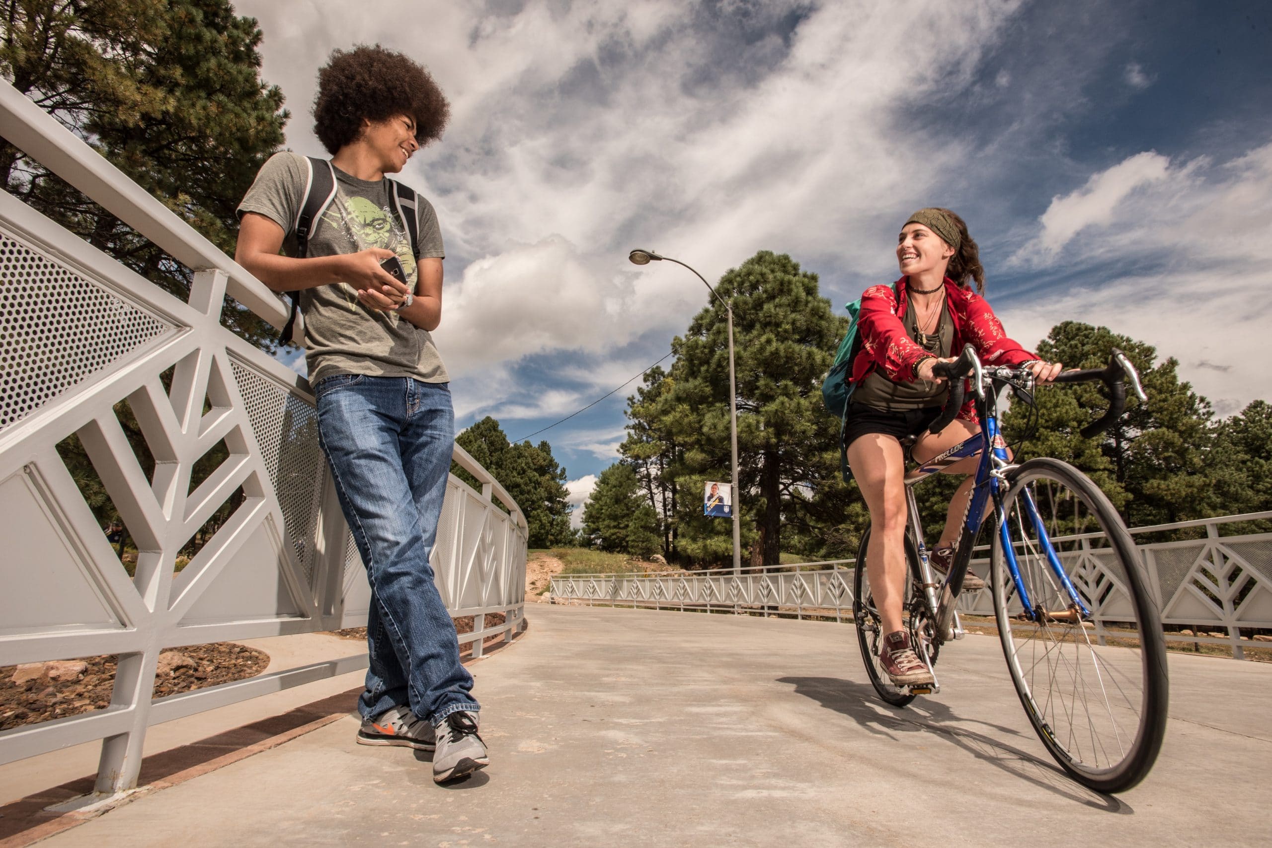 Students talking outside on campus.