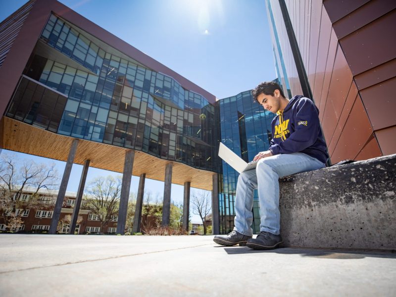 Student working on laptop at Flagstaff campus.