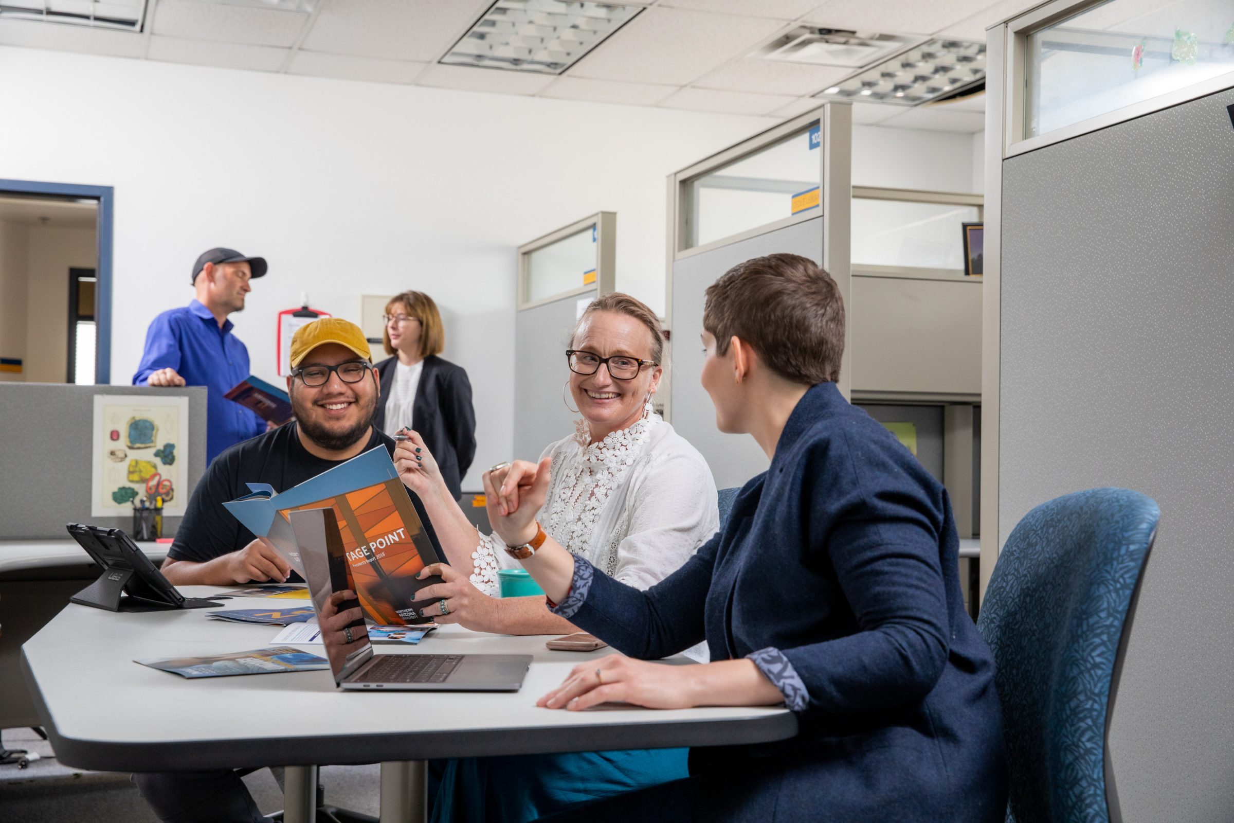 N A U staff members working collaboratively in the University Marketing department