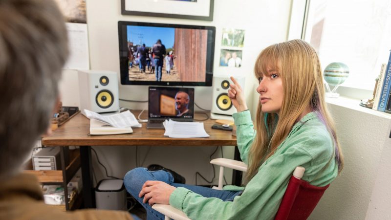N A U student Mackenzie Baradic points to a computer monitor.