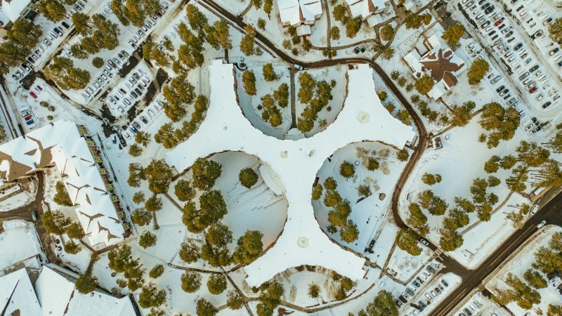 An aerial image of N A U's Flagstaff Mountain campus in the winter.