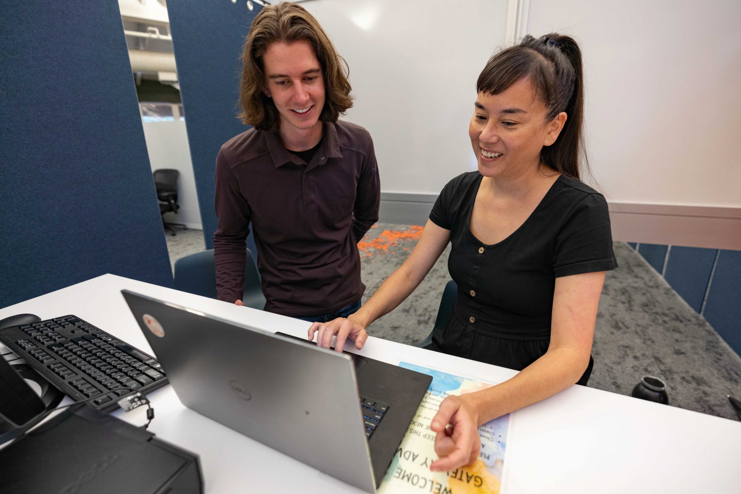 Two N A U students working together on a laptop.