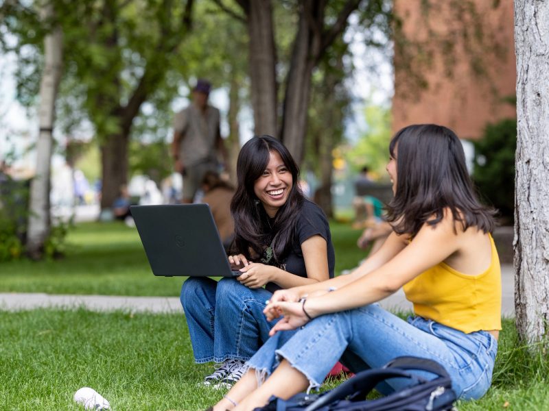 Two students hanging out on the N A U campus.