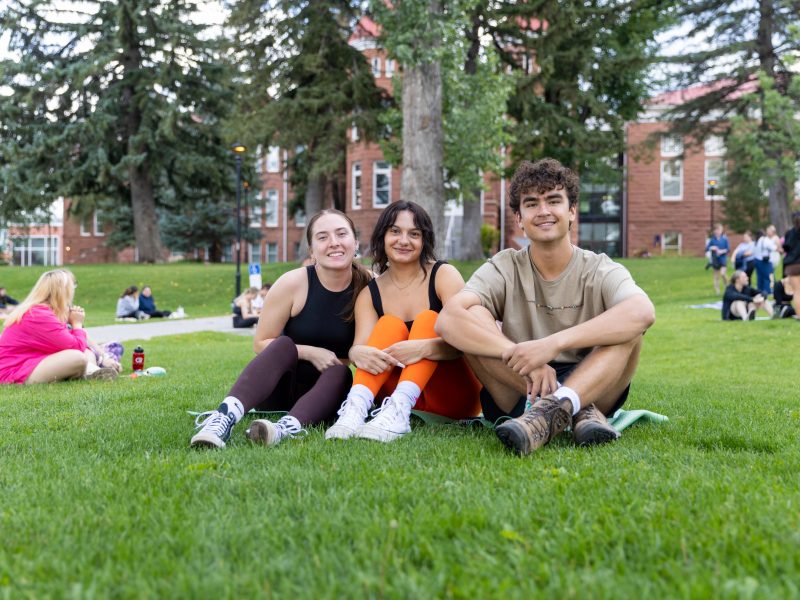 Students do yoga in the quad at N A U.
