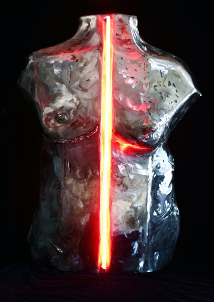 A painting of a nude body split in half by a bright red line titled "Transition."