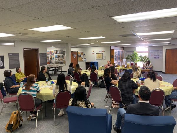 Luis Urrea leads a workshop with students on April 22.