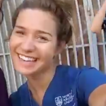 NAU student smiling with an NAU shirt on.