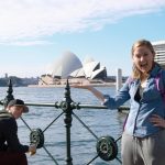 NAU student posing with a famous building in the background in Adelaide