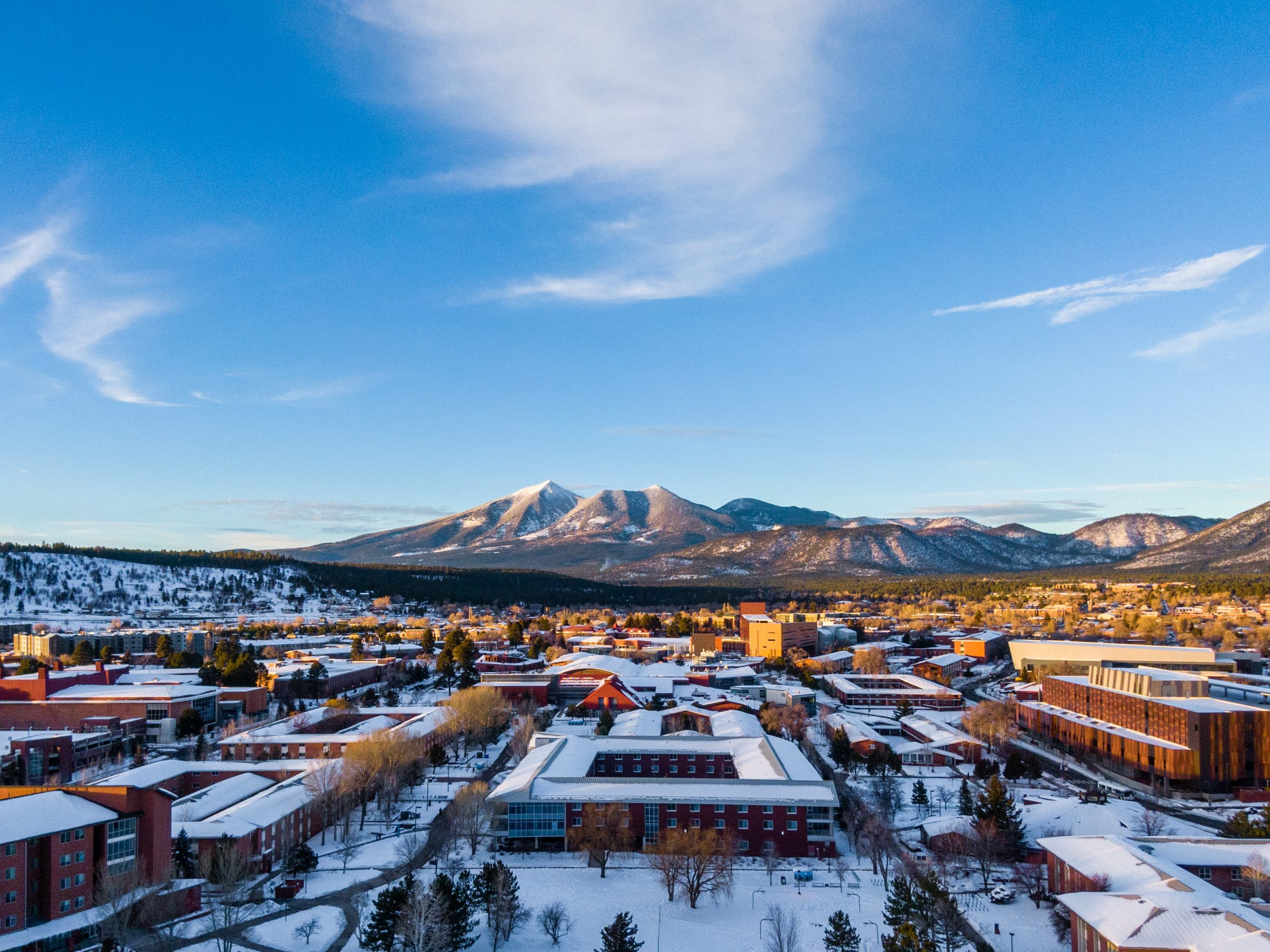 Drone shot of a snowy campus.