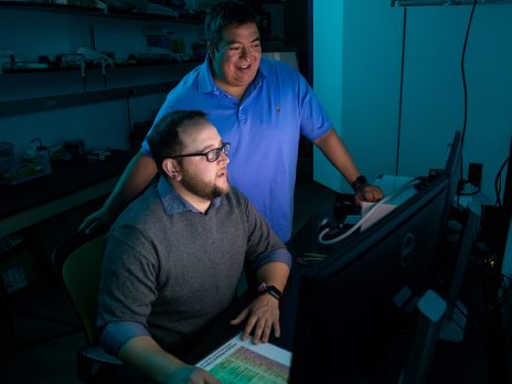 Professor with graduate student in the materials science lab.