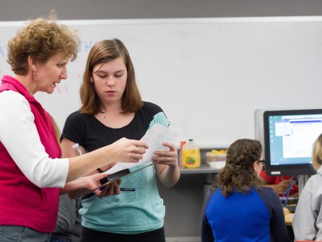 teacher explaining a problem to a student 
