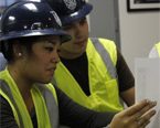 Two Construction Management students working together