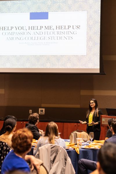 Student presenting at culminating REU conference.