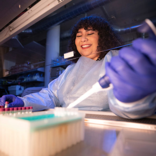 Kaitlyn Parra pipes a substance in a lab