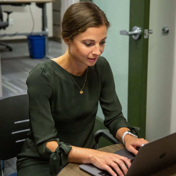 Taylor Lane works on a laptop