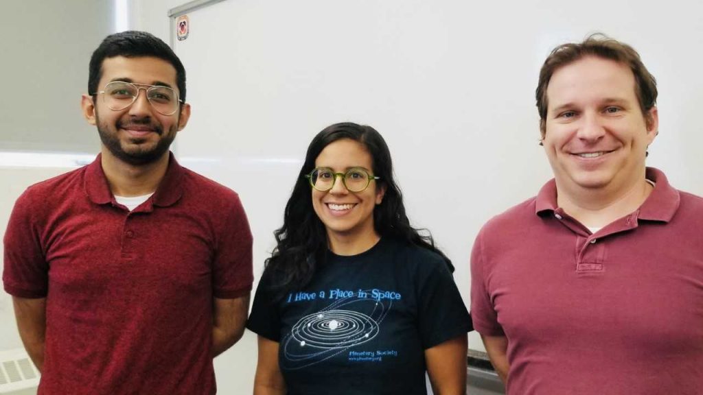 Planetary science intern, Ahmed AlHantoobi, working with Associate Professor Christopher Edwards and postdoctoral scholar Jennifer Buz.