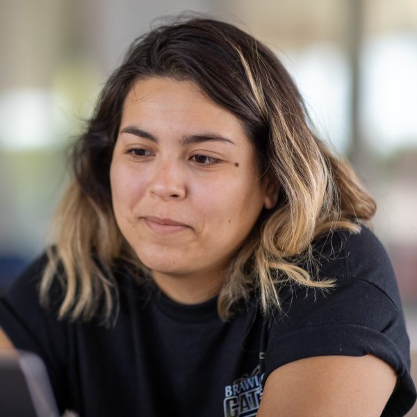 Angela Sornia studying at a laptop.
