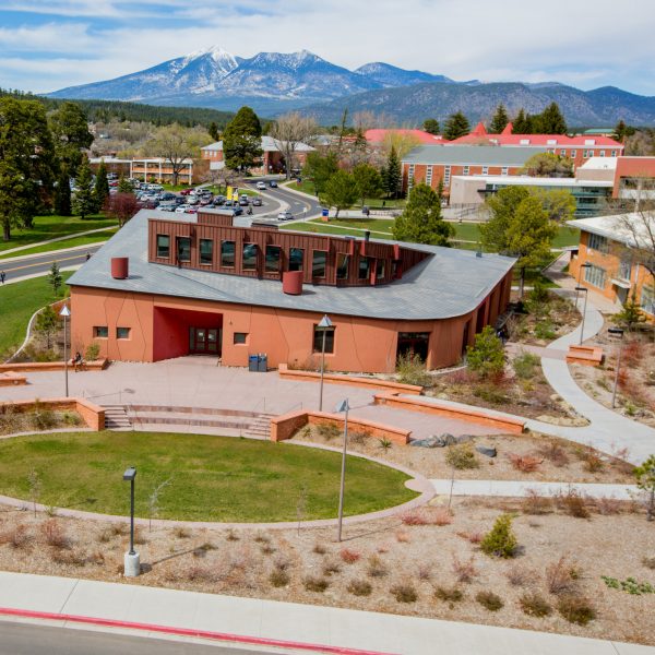 Drone overview of the NAU Flagstaff campus showing the NACC and the San Francisco Peaks.