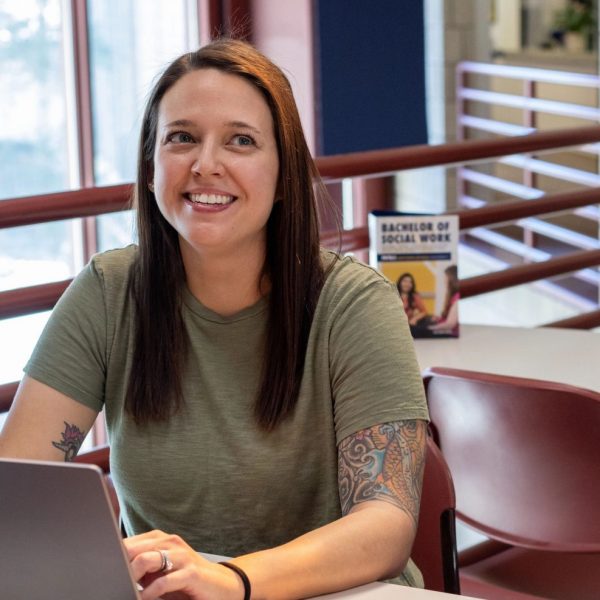 Jessica Stuart sits at her laptop at NAU–Yuma.