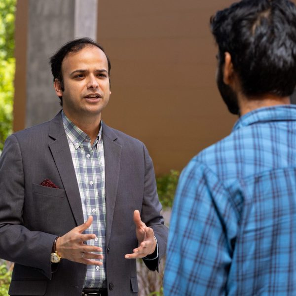 CIE staff helps international student.
