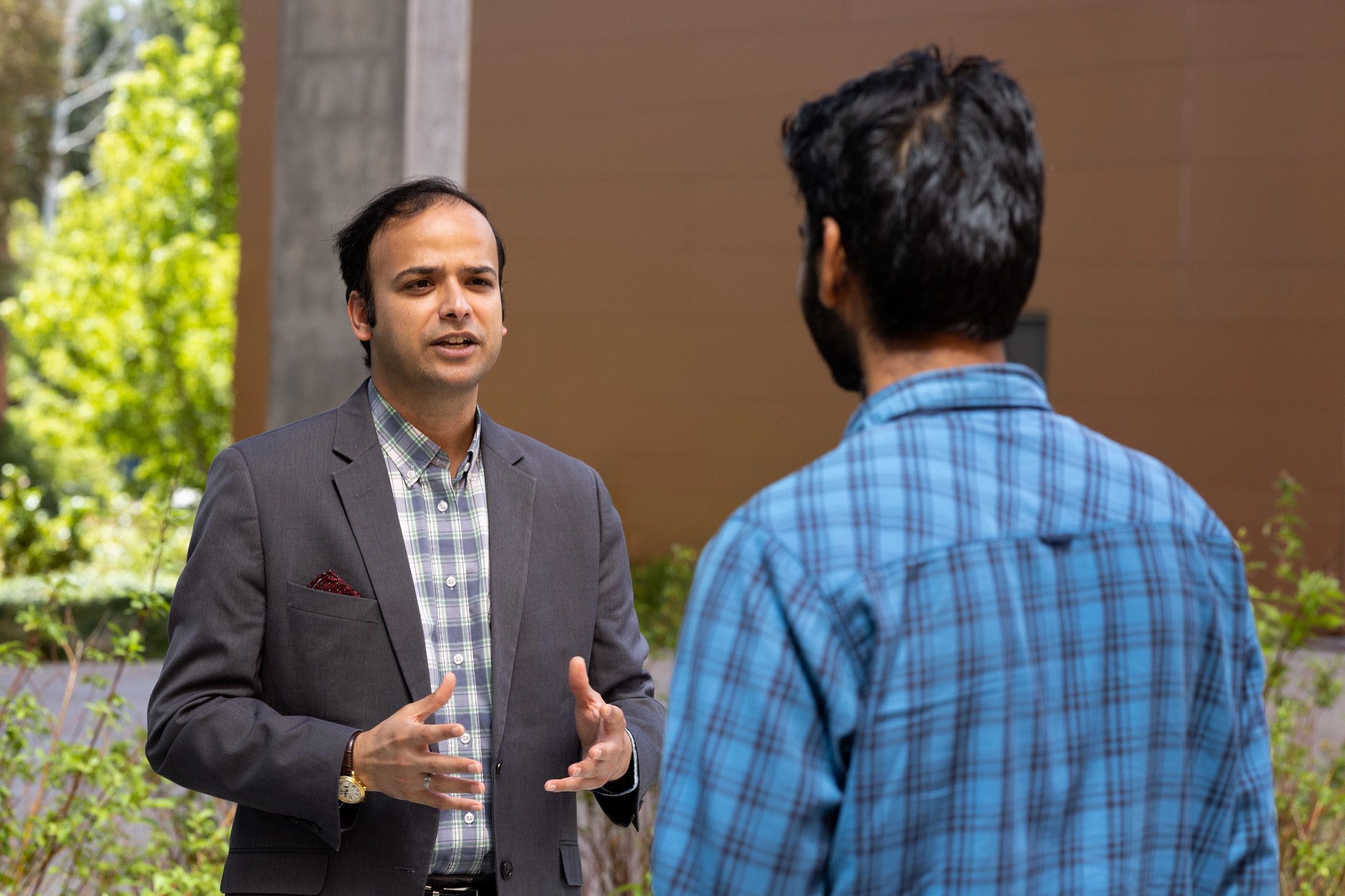 CIE staff helps international student.