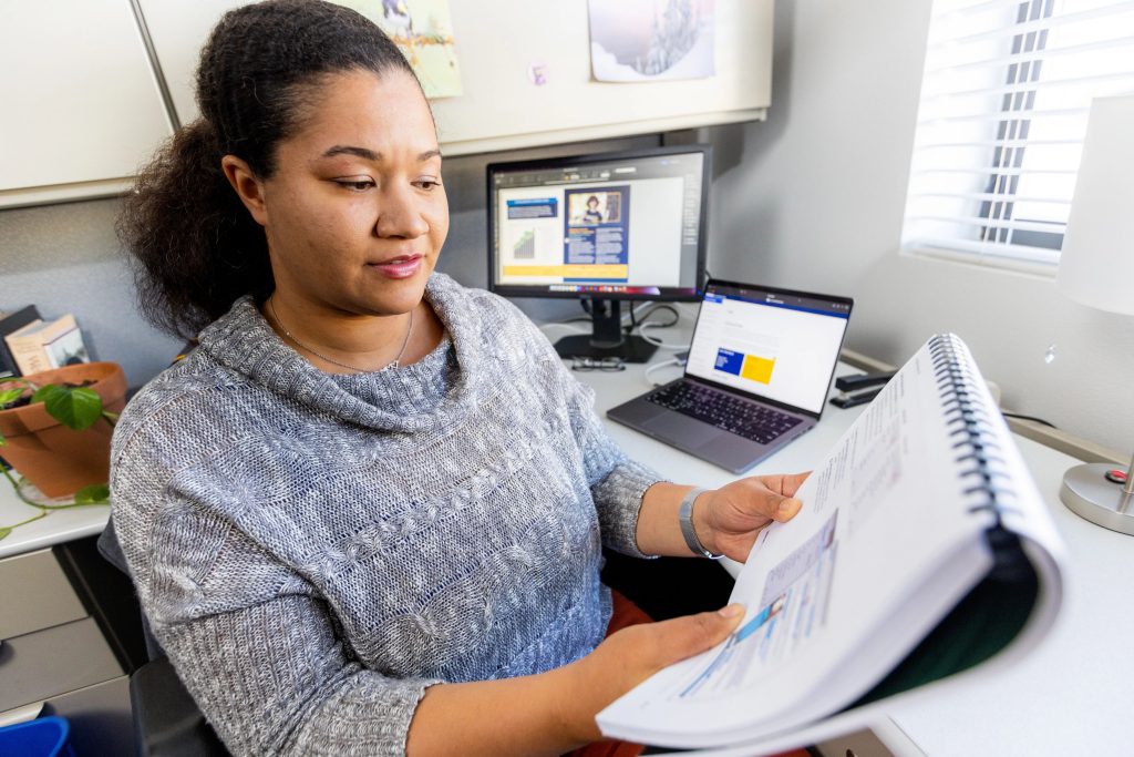 NAU graphic designer Charlese Bedford working on web accessibility.