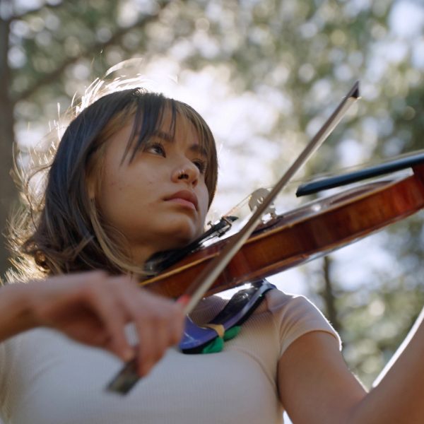 Honors sociology major and Flinn Scholar Kaya Dickson plays the violin.