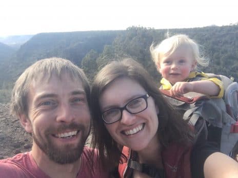 Anne and her family taking a selfie in front of forest views