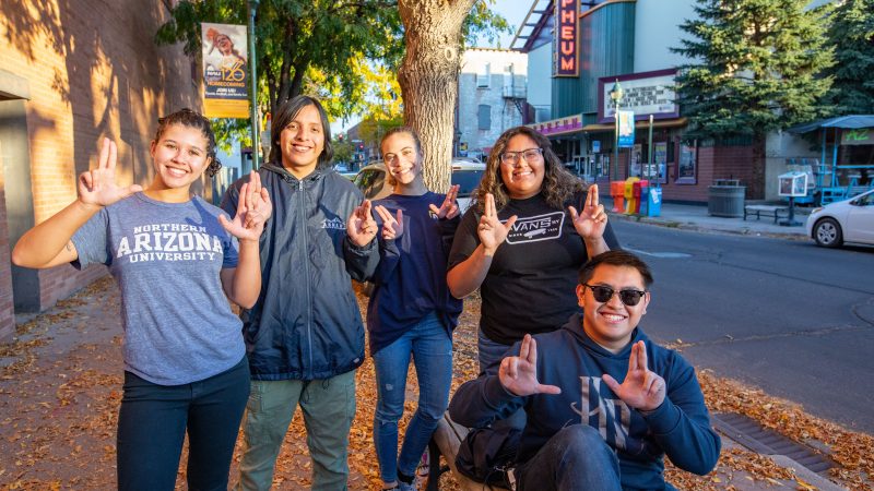 Lumberjack students in downtown Flagstaff by the Orpheum.