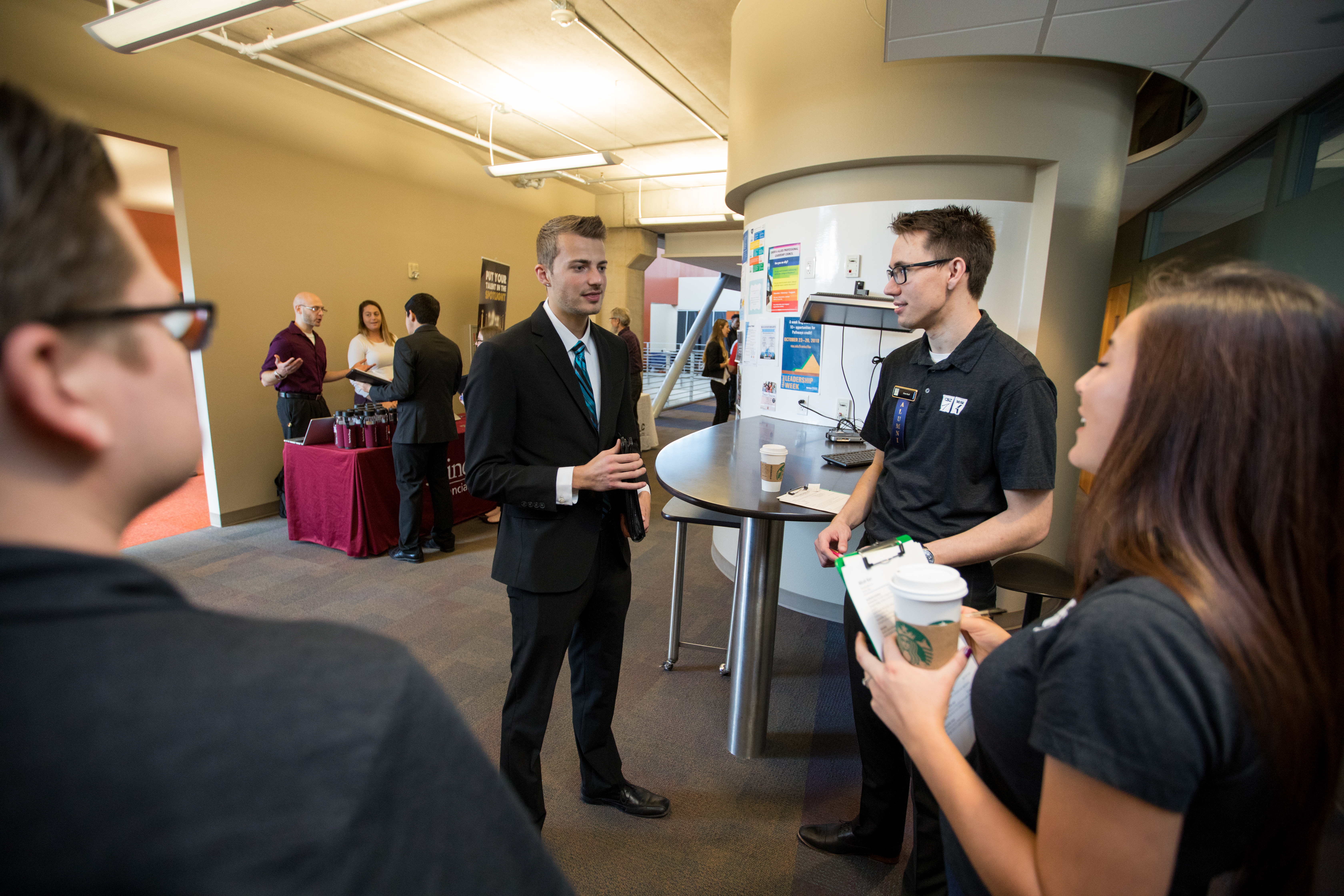Students and employers participating in a career fair.