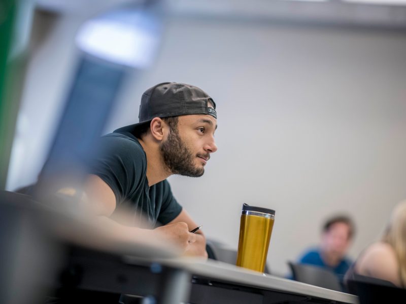 Student listening to lecture.