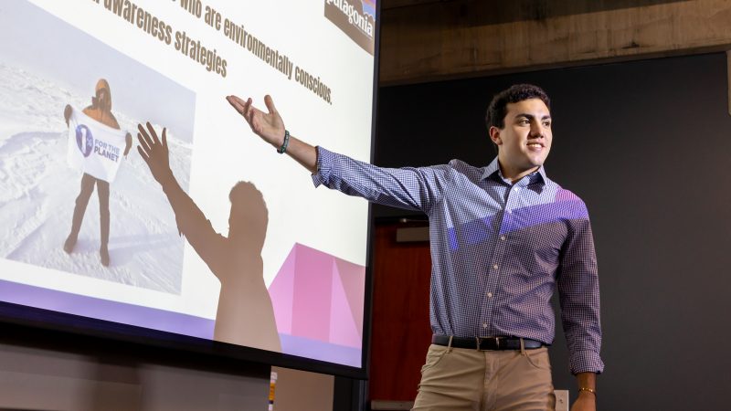 N A U student leading a presentation.