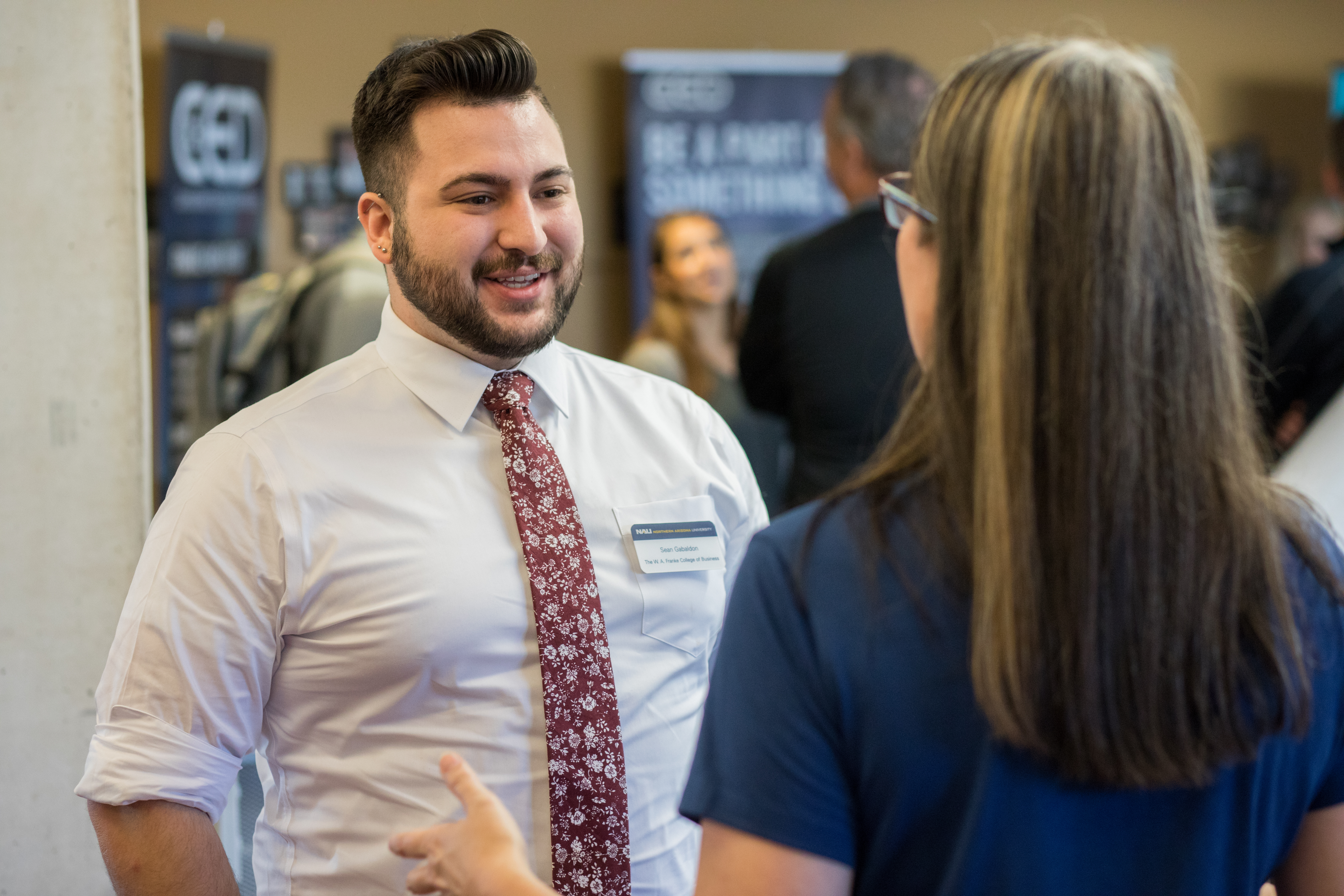 Students talking at the franke college business career fair.