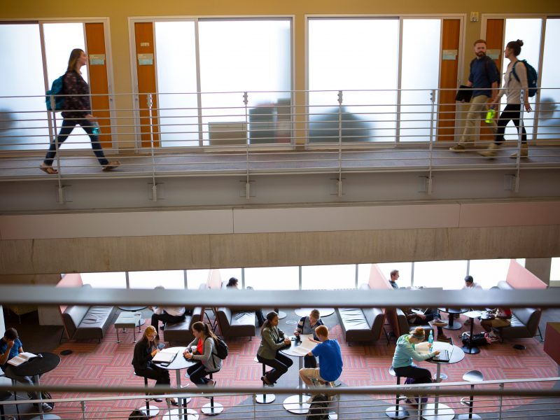 Students and faculty working in the business college.
