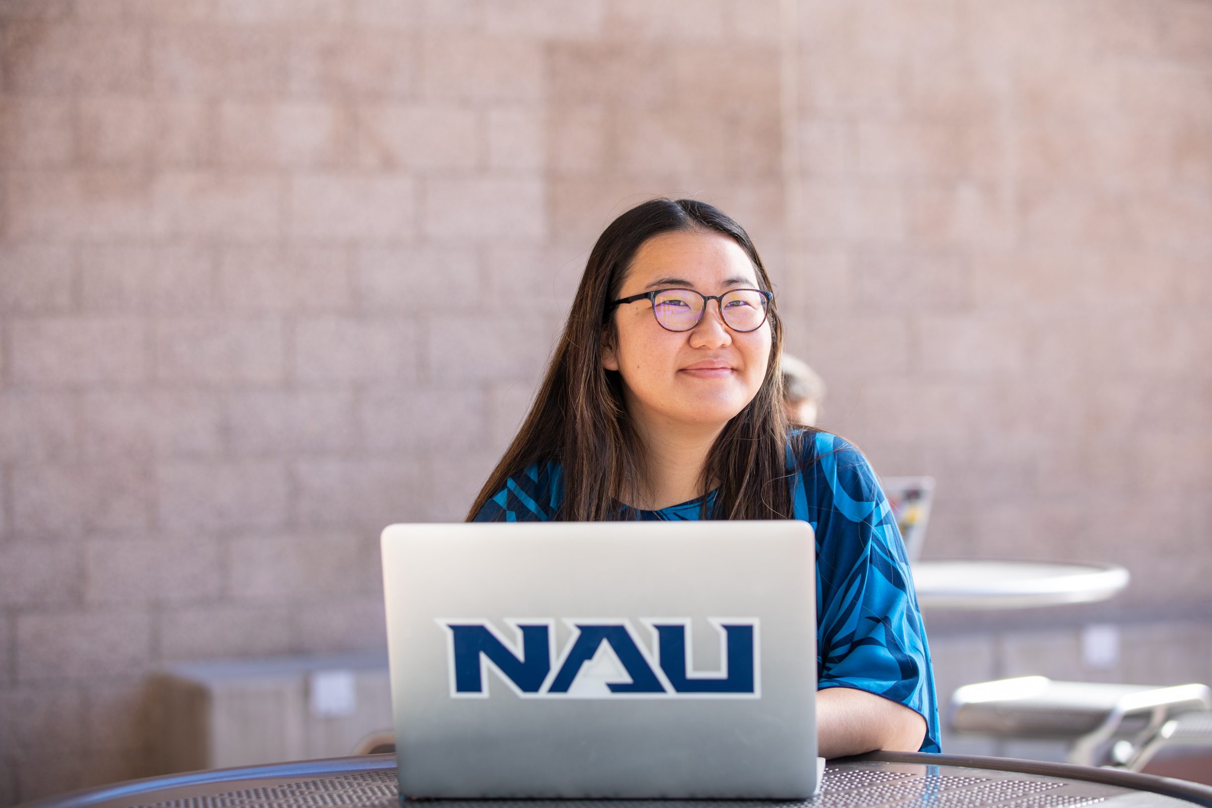 Student on her laptop outdoors.
