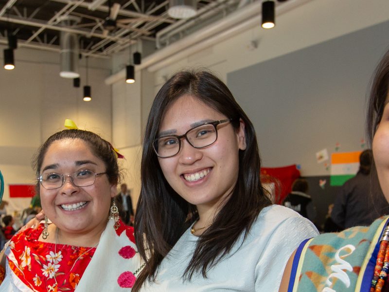 Students smiling in the International Pavilion.