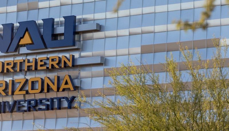 A large building with the N A U logo.