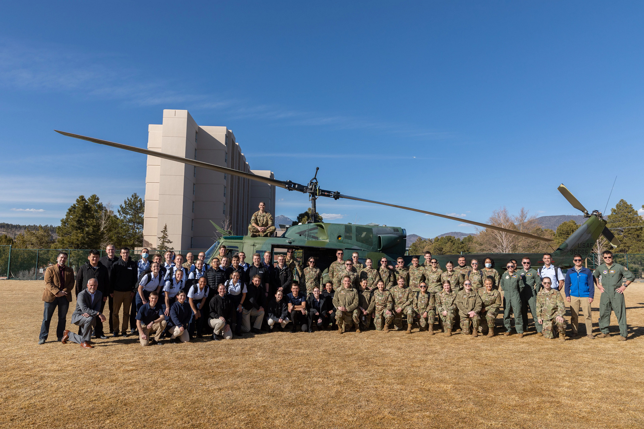 NAU Air Force ROTC students in uniforms with a helicopter