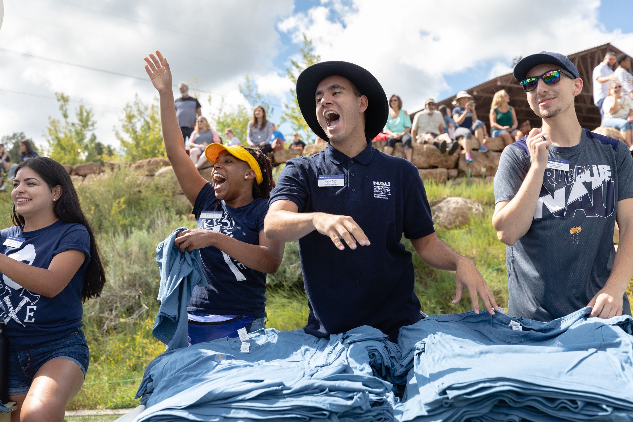NAU staff members handing out tshirts