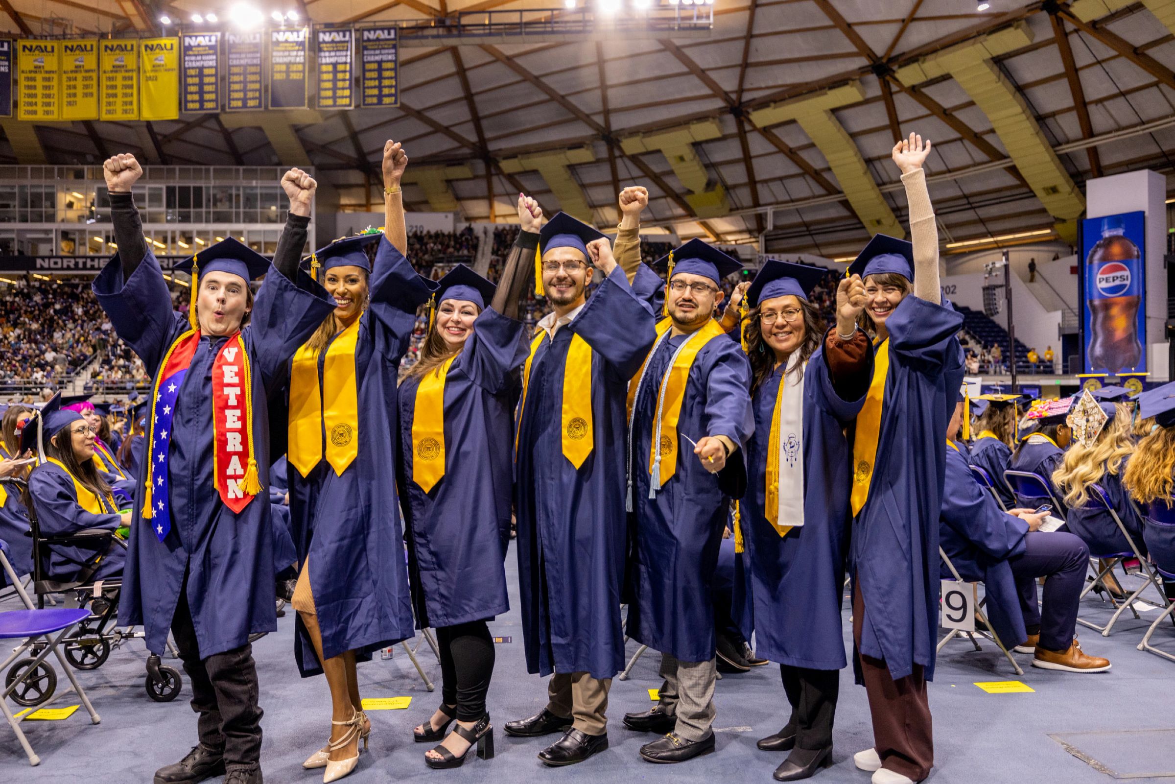 Students celebrate at N A U commencement.