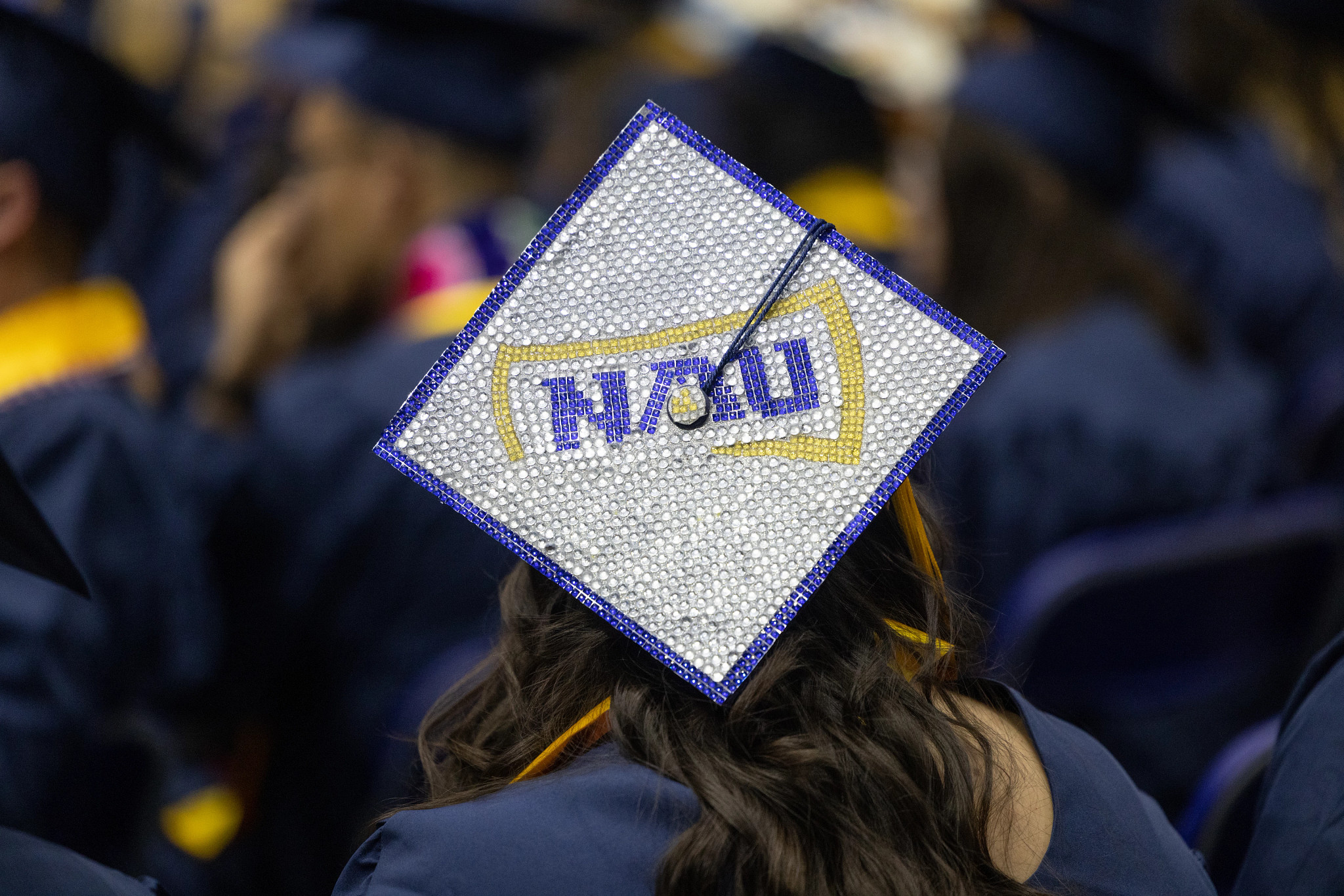 N A U graduation cap.