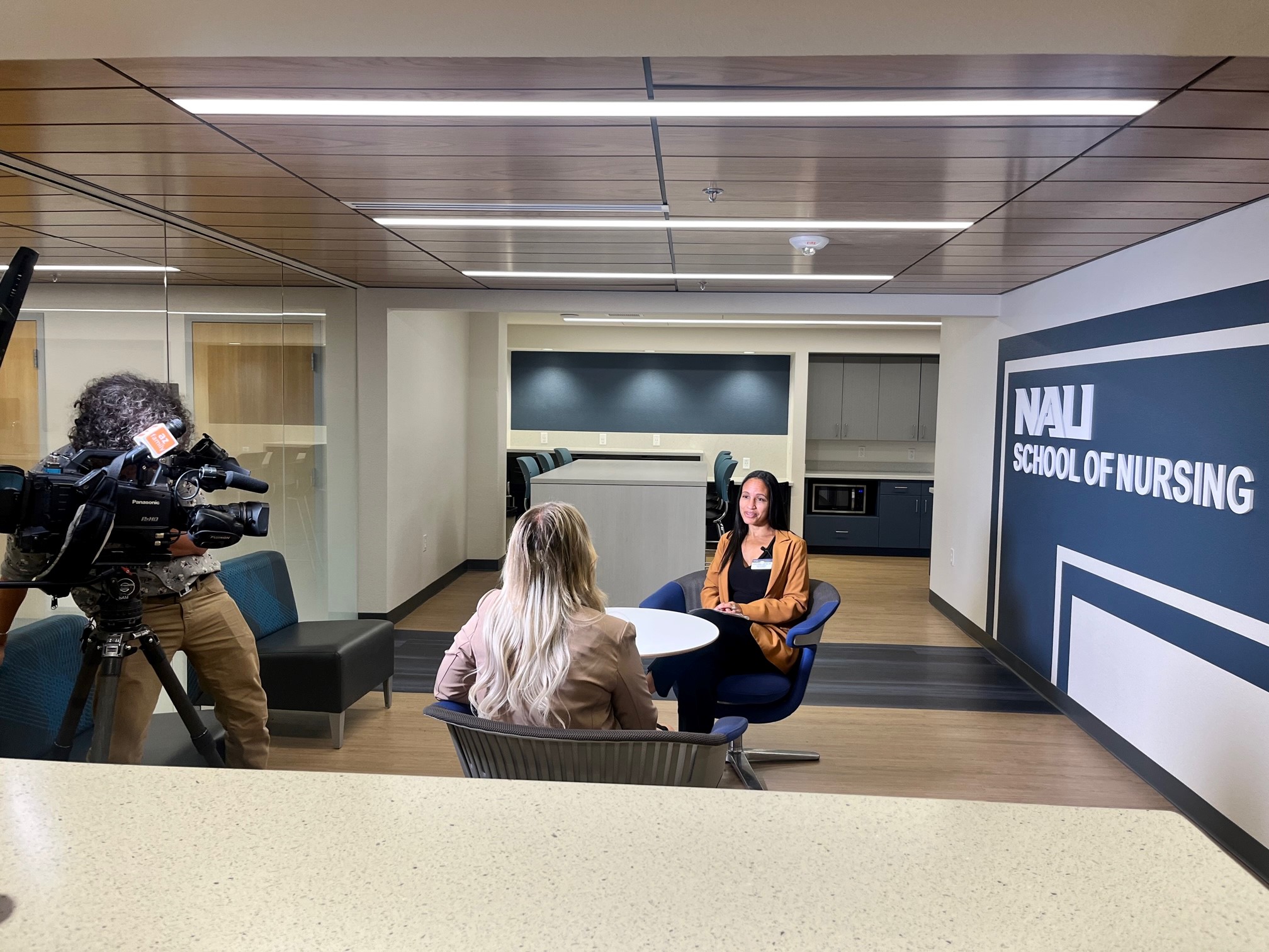 A news anchor interviews a NAU nurse.